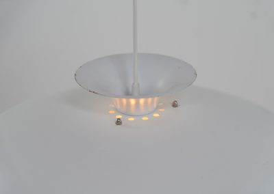 Pendant light by Form Light (Denmark, 1970s). The lamp is crafted out of five metal shades and gives a stunning light dispersion. In good condition with some minor rust stains and paint scratches consistent with its Age.
