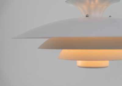 Pendant light by Form Light (Denmark, 1970s). The lamp is crafted out of five metal shades and gives a stunning light dispersion. In good condition with some minor rust stains and paint scratches consistent with its Age.
