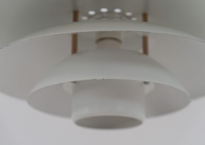 Pendant light by Form Light (Denmark, 1970s). The lamp is crafted out of five metal shades and gives a stunning light dispersion. In good condition with some minor rust stains and paint scratches consistent with its Age.