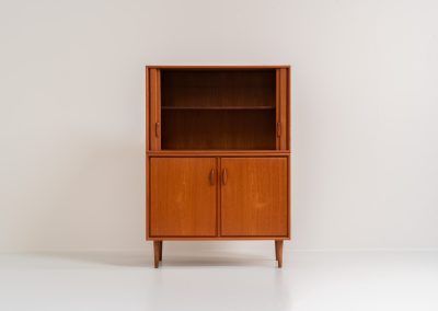 Highboard with tambour doors by Heinrich Riestenpatt for RT Möbel (Germany, 1960s). This rarely seen highboard is made by German designer Heinrich Riestenpatt, executed in warm teak. The clean, architectural form is complemented by stunning tambour doors, organic handles and beautifully balanced proportions. A distinctive feature of this piece is the extractable shelve in the cabinet, making it ideal to use for a vinyl player. A timeless example of German modern design, presented in excellent vintage condition.