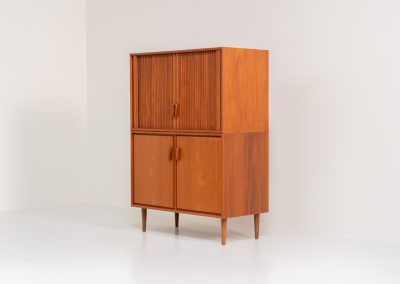 Highboard with tambour doors by Heinrich Riestenpatt for RT Möbel (Germany, 1960s). This rarely seen highboard is made by German designer Heinrich Riestenpatt, executed in warm teak. The clean, architectural form is complemented by stunning tambour doors, organic handles and beautifully balanced proportions. A distinctive feature of this piece is the extractable shelve in the cabinet, making it ideal to use for a vinyl player. A timeless example of German modern design, presented in excellent vintage condition.