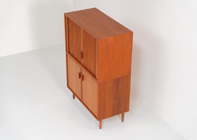Highboard with tambour doors by Heinrich Riestenpatt for RT Möbel (Germany, 1960s). This rarely seen highboard is made by German designer Heinrich Riestenpatt, executed in warm teak. The clean, architectural form is complemented by stunning tambour doors, organic handles and beautifully balanced proportions. A distinctive feature of this piece is the extractable shelve in the cabinet, making it ideal to use for a vinyl player. A timeless example of German modern design, presented in excellent vintage condition.