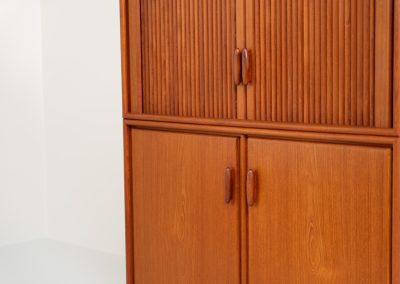 Highboard with tambour doors by Heinrich Riestenpatt for RT Möbel (Germany, 1960s). This rarely seen highboard is made by German designer Heinrich Riestenpatt, executed in warm teak. The clean, architectural form is complemented by stunning tambour doors, organic handles and beautifully balanced proportions. A distinctive feature of this piece is the extractable shelve in the cabinet, making it ideal to use for a vinyl player. A timeless example of German modern design, presented in excellent vintage condition.