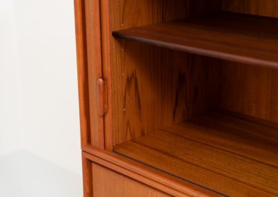 Highboard with tambour doors by Heinrich Riestenpatt for RT Möbel (Germany, 1960s). This rarely seen highboard is made by German designer Heinrich Riestenpatt, executed in warm teak. The clean, architectural form is complemented by stunning tambour doors, organic handles and beautifully balanced proportions. A distinctive feature of this piece is the extractable shelve in the cabinet, making it ideal to use for a vinyl player. A timeless example of German modern design, presented in excellent vintage condition.