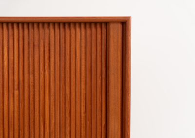 Highboard with tambour doors by Heinrich Riestenpatt for RT Möbel (Germany, 1960s). This rarely seen highboard is made by German designer Heinrich Riestenpatt, executed in warm teak. The clean, architectural form is complemented by stunning tambour doors, organic handles and beautifully balanced proportions. A distinctive feature of this piece is the extractable shelve in the cabinet, making it ideal to use for a vinyl player. A timeless example of German modern design, presented in excellent vintage condition.