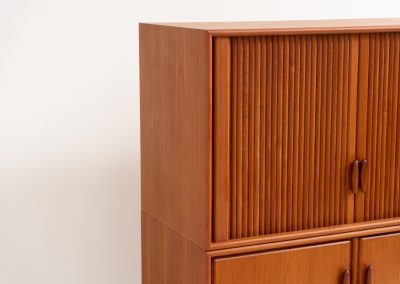Highboard with tambour doors by Heinrich Riestenpatt for RT Möbel (Germany, 1960s). This rarely seen highboard is made by German designer Heinrich Riestenpatt, executed in warm teak. The clean, architectural form is complemented by stunning tambour doors, organic handles and beautifully balanced proportions. A distinctive feature of this piece is the extractable shelve in the cabinet, making it ideal to use for a vinyl player. A timeless example of German modern design, presented in excellent vintage condition.
