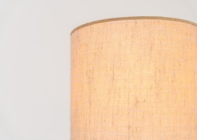 Sculptural table lamp in the manner of Charles Dudouyt (France, 1950s). This lamp offers a refined blend of beautiful textures and a highly sculptural silhouette. It has a handcrafted wooden base with lots of detail, complimented by a linnen shade. The lamp remains in splendid condition.