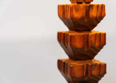 Sculptural table lamp in the manner of Charles Dudouyt (France, 1950s). This lamp offers a refined blend of beautiful textures and a highly sculptural silhouette. It has a handcrafted wooden base with lots of detail, complimented by a linnen shade. The lamp remains in splendid condition.