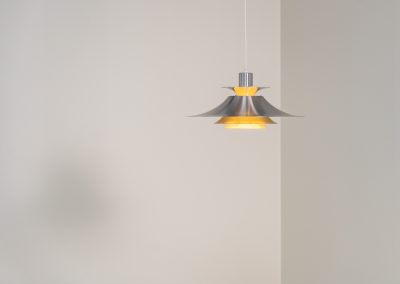 Brushed aluminium pendant light by Frandsen (Denmark, 1970s). A beautiful lamp made out of four aluminium shades and featuring an elegant silhouette. The lamp remains in splendid condition.