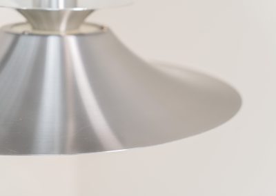 Brushed aluminium pendant light by Frandsen (Denmark, 1970s). A beautiful lamp made out of four aluminium shades and featuring an elegant silhouette. The lamp remains in splendid condition.