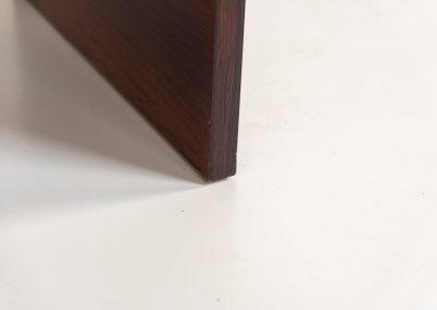 Rare double-sided “Vario” desk by Werner Wölfer for V-Form (Belgium, 1960s). This exceptionally beautiful piece is a true example of top-quality Belgian craftsmanship. Made from Rosewood, it showcases sleek aesthetics with contrasting details and a wonderful vivid woodgrain. It offers four drawers, a large top and a finished backside, making it an ideal piece for placement in the center of a room. The desk is restored and in very good condition, with minor using traces.