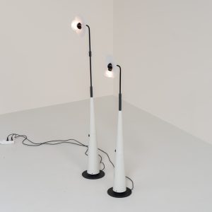 Stunning pair of “Club 1095” floor lamps by Giuseppe Ramella for Arteluce (Italy, 1980s). A beautiful example of Italian minimalist design, the Club 1095 combines a clean, architectural silhouette with a highly functional design. The height of the lamp is adjustable, while the diffuser can be angled to direct the light exactly where it is needed. With their understated presence and timeless aesthetic, these lamps work beautifully in both contemporary and more eclectic interiors, equally striking as a pair or as a standalone piece. Both lamps are in excellent vintage condition. Available individually or as a pair.