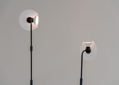 Stunning pair of “Club 1095” floor lamps by Giuseppe Ramella for Arteluce (Italy, 1980s). A beautiful example of Italian minimalist design, the Club 1095 combines a clean, architectural silhouette with a highly functional design. The height of the lamp is adjustable, while the diffuser can be angled to direct the light exactly where it is needed. With their understated presence and timeless aesthetic, these lamps work beautifully in both contemporary and more eclectic interiors, equally striking as a pair or as a standalone piece. Both lamps are in excellent vintage condition. Available individually or as a pair.