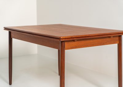 Danish extendable dining table, 1960s. A beautiful Danish extendable dining table that can easily be extended from 126 cm to 174 cm with one extension or to 223 cm with two extensions. The table is in very good condition, features a lovely wood grain and has beautiful tapered legs.