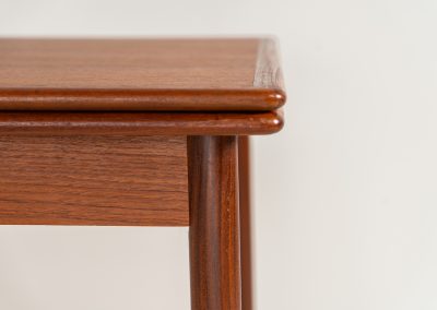 Danish extendable dining table, 1960s. A beautiful Danish extendable dining table that can easily be extended from 126 cm to 174 cm with one extension or to 223 cm with two extensions. The table is in very good condition, features a lovely wood grain and has beautiful tapered legs.