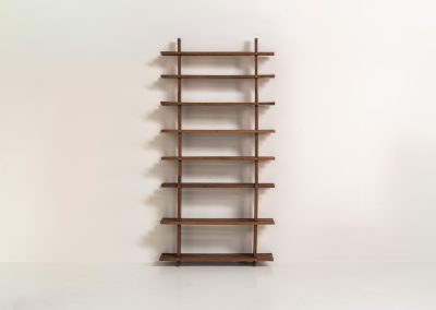 Sculptural wengé slat bookcase (Europe, 1960s). A sculptural bookcase defined by the rhythmic interplay of solid wengé slats and slender vertical supports. Its distinctive stepped construction, tapering towards the top, gives the piece an almost totemic presence. Both a functional piece of furniture and an architectural object. As we have been unable to find any documentation or comparable examples, this may well be a one-of-a-kind piece, reminiscent of the work of Fabrizio Mangoni. The bookcase is in beautiful vintage condition, with minor signs of age and use, including a few slightly warped slats.