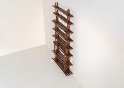 Sculptural wengé slat bookcase (Europe, 1960s). A sculptural bookcase defined by the rhythmic interplay of solid wengé slats and slender vertical supports. Its distinctive stepped construction, tapering towards the top, gives the piece an almost totemic presence. Both a functional piece of furniture and an architectural object. As we have been unable to find any documentation or comparable examples, this may well be a one-of-a-kind piece, reminiscent of the work of Fabrizio Mangoni. The bookcase is in beautiful vintage condition, with minor signs of age and use, including a few slightly warped slats.
