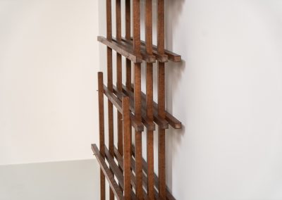 Sculptural wengé slat bookcase (Europe, 1960s). A sculptural bookcase defined by the rhythmic interplay of solid wengé slats and slender vertical supports. Its distinctive stepped construction, tapering towards the top, gives the piece an almost totemic presence. Both a functional piece of furniture and an architectural object. As we have been unable to find any documentation or comparable examples, this may well be a one-of-a-kind piece, reminiscent of the work of Fabrizio Mangoni. The bookcase is in beautiful vintage condition, with minor signs of age and use, including a few slightly warped slats.