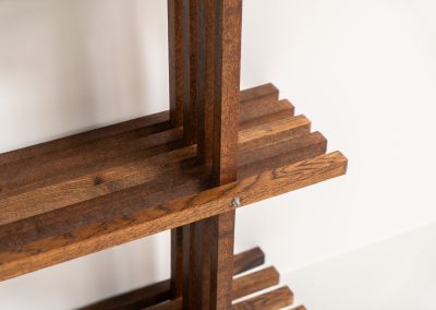 Sculptural wengé slat bookcase (Europe, 1960s). A sculptural bookcase defined by the rhythmic interplay of solid wengé slats and slender vertical supports. Its distinctive stepped construction, tapering towards the top, gives the piece an almost totemic presence. Both a functional piece of furniture and an architectural object. As we have been unable to find any documentation or comparable examples, this may well be a one-of-a-kind piece, reminiscent of the work of Fabrizio Mangoni. The bookcase is in beautiful vintage condition, with minor signs of age and use, including a few slightly warped slats.