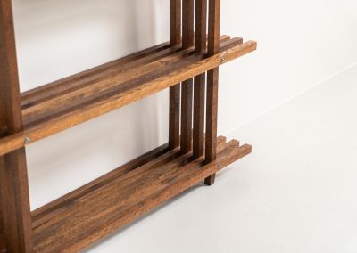 Sculptural wengé slat bookcase (Europe, 1960s). A sculptural bookcase defined by the rhythmic interplay of solid wengé slats and slender vertical supports. Its distinctive stepped construction, tapering towards the top, gives the piece an almost totemic presence. Both a functional piece of furniture and an architectural object. As we have been unable to find any documentation or comparable examples, this may well be a one-of-a-kind piece, reminiscent of the work of Fabrizio Mangoni. The bookcase is in beautiful vintage condition, with minor signs of age and use, including a few slightly warped slats.