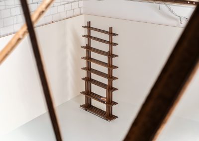 Sculptural wengé slat bookcase (Europe, 1960s). A sculptural bookcase defined by the rhythmic interplay of solid wengé slats and slender vertical supports. Its distinctive stepped construction, tapering towards the top, gives the piece an almost totemic presence. Both a functional piece of furniture and an architectural object. As we have been unable to find any documentation or comparable examples, this may well be a one-of-a-kind piece, reminiscent of the work of Fabrizio Mangoni. The bookcase is in beautiful vintage condition, with minor signs of age and use, including a few slightly warped slats.
