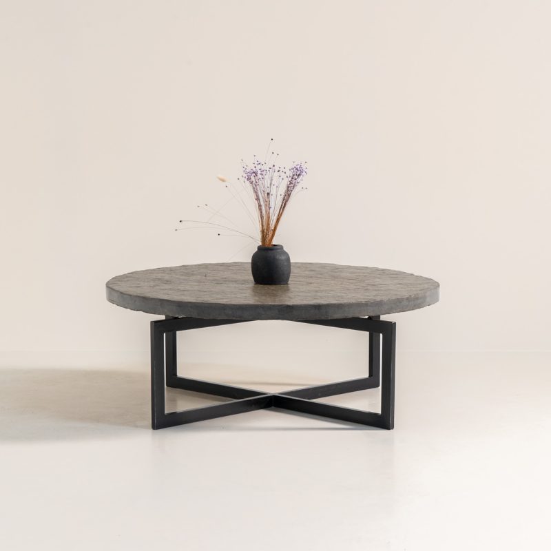 Coffee Table in Norwegian Slate stone, 1970s A very powerful brutalist coffee table from the 1970s, defined by its strong architectural presence and sculptural simplicity. The substantial tabletop is crafted from Norwegian slate, showcasing a rich and varied surface with natural tonal shifts that create depth and visual texture. The solid stone top is supported by a black lacquered metal base, offering a bold contrast while reinforcing the table’s grounded and monolithic character. The table remains in very good condition, with light, age-appropriate wear such as minor scratches to the frame.