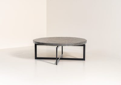 Coffee Table in Norwegian Slate stone, 1970s A very powerful brutalist coffee table from the 1970s, defined by its strong architectural presence and sculptural simplicity. The substantial tabletop is crafted from Norwegian slate, showcasing a rich and varied surface with natural tonal shifts that create depth and visual texture. The solid stone top is supported by a black lacquered metal base, offering a bold contrast while reinforcing the table’s grounded and monolithic character. The table remains in very good condition, with light, age-appropriate wear such as minor scratches to the frame.