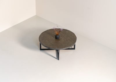 Coffee Table in Norwegian Slate stone, 1970s A very powerful brutalist coffee table from the 1970s, defined by its strong architectural presence and sculptural simplicity. The substantial tabletop is crafted from Norwegian slate, showcasing a rich and varied surface with natural tonal shifts that create depth and visual texture. The solid stone top is supported by a black lacquered metal base, offering a bold contrast while reinforcing the table’s grounded and monolithic character. The table remains in very good condition, with light, age-appropriate wear such as minor scratches to the frame.