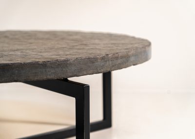 Coffee Table in Norwegian Slate stone, 1970s A very powerful brutalist coffee table from the 1970s, defined by its strong architectural presence and sculptural simplicity. The substantial tabletop is crafted from Norwegian slate, showcasing a rich and varied surface with natural tonal shifts that create depth and visual texture. The solid stone top is supported by a black lacquered metal base, offering a bold contrast while reinforcing the table’s grounded and monolithic character. The table remains in very good condition, with light, age-appropriate wear such as minor scratches to the frame.